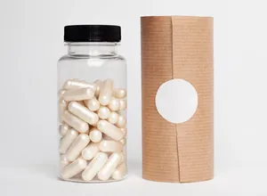 White capsules in a clear supplement bottle