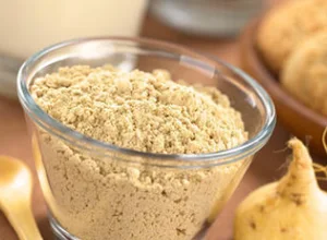 Maca root and maca powder in a bowl